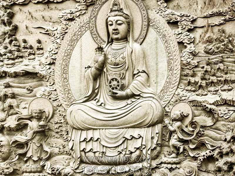 户外景区墙壁上的石雕观音雕塑