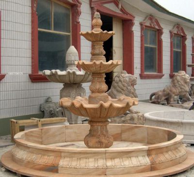 庭院里摆放的四层花岗岩石雕创意喷水雕塑