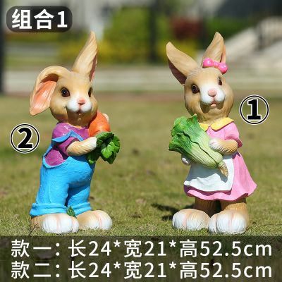 饭店门口两只抱着蔬菜的玻璃钢兔子雕塑