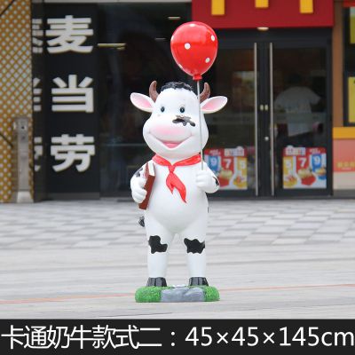商厦一只举着气球的玻璃钢牛雕塑