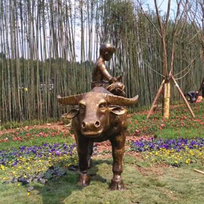 户外广场玻璃钢仿铜坐在牛背上的儿童雕塑