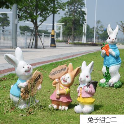 游乐场四只忙碌的树脂兔子雕塑