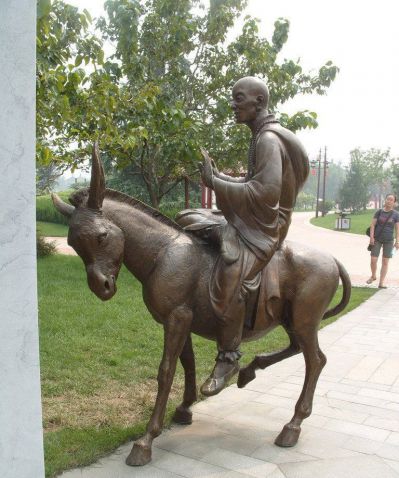 公园铜雕骑着毛驴的和尚雕塑