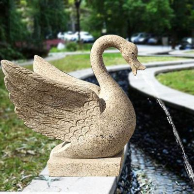 湖边大理石切面喷水展翅天鹅雕塑