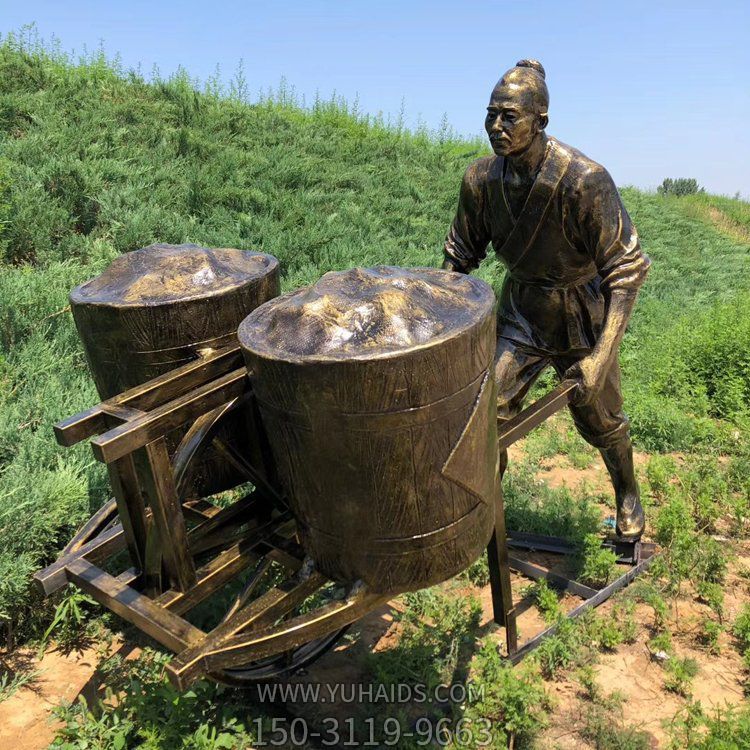 用独轮车运粮食的农民雕塑