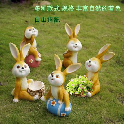 别墅摆放五只卡通黄色玻璃钢兔子雕塑