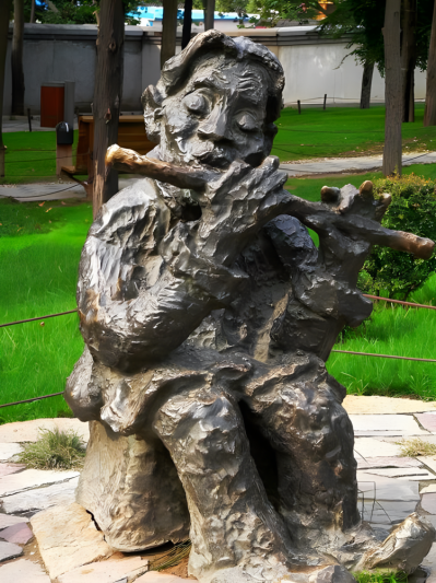 黄铜铸造吹笛子的写意人物雕塑